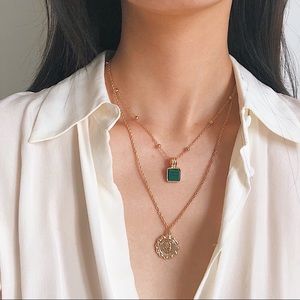Gold tone layered chain with jade pendent